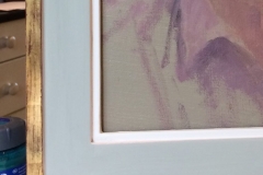 Detail of distressed gold and early layers of colour on gesso -