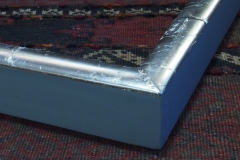 Unburnished platinum with painted gesso, corner detail